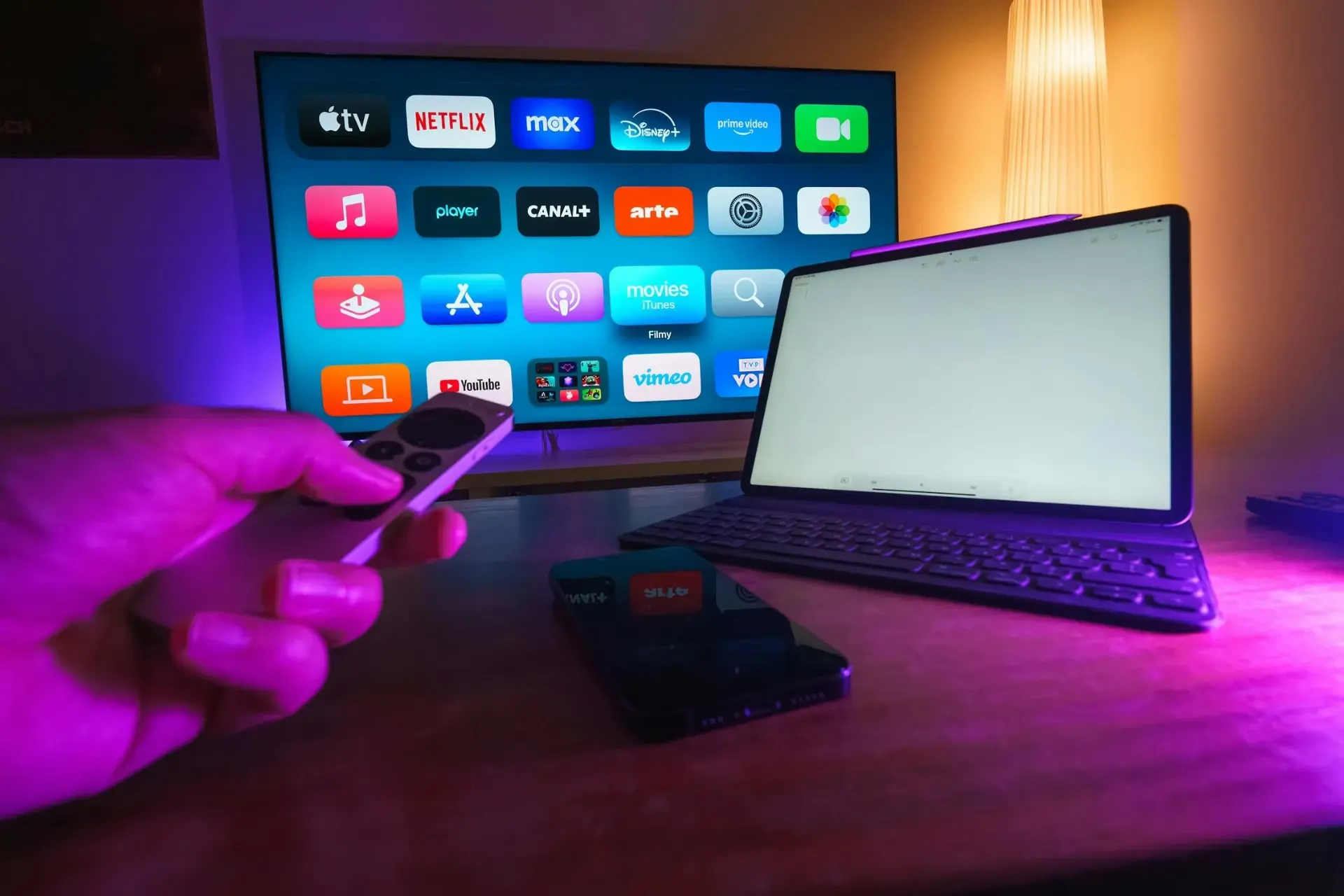 Smart TV with streaming apps and laptop